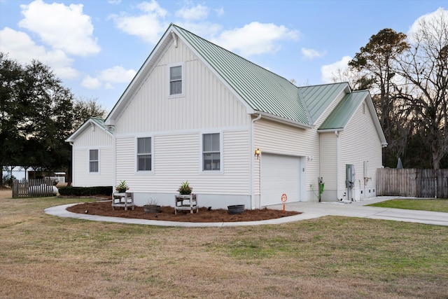 view of side of home featuring a yard, fence, and driveway