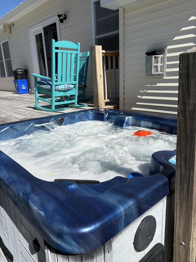 exterior space featuring a hot tub and a wooden deck