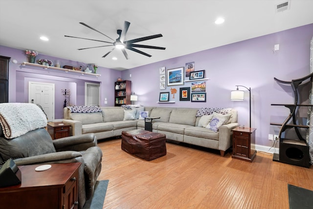 living area featuring light wood finished floors, baseboards, visible vents, a ceiling fan, and recessed lighting