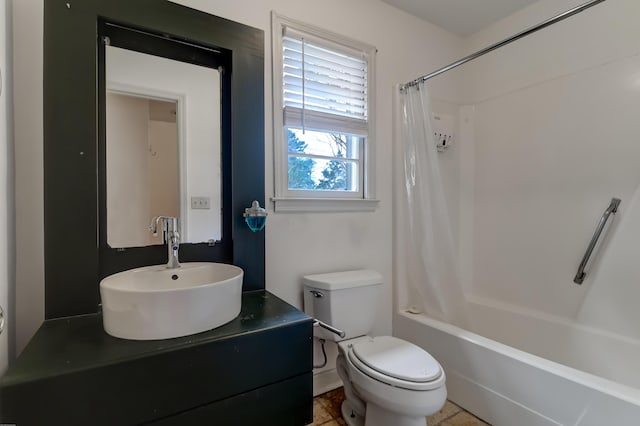 bathroom with a sink, toilet, and shower / bathtub combination with curtain