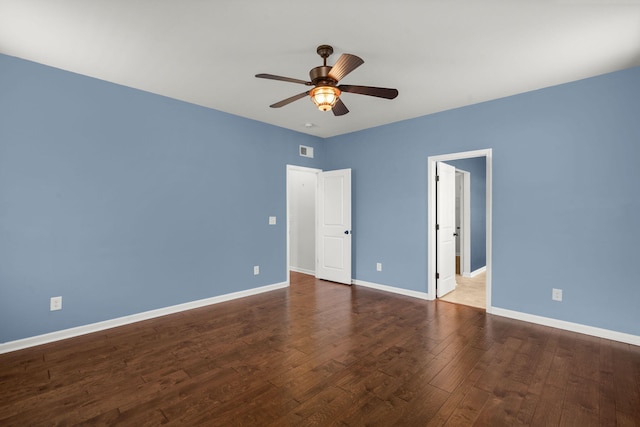 unfurnished bedroom with ceiling fan and dark wood-type flooring