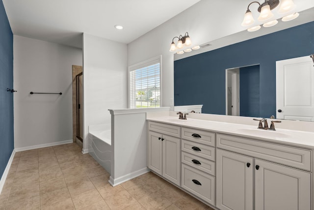 bathroom with tile patterned floors, vanity, and separate shower and tub