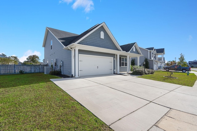 view of front of property featuring a garage and a front yard