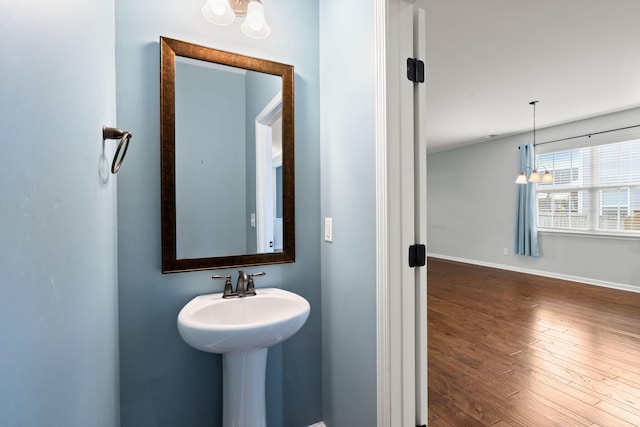 bathroom with sink and wood-type flooring