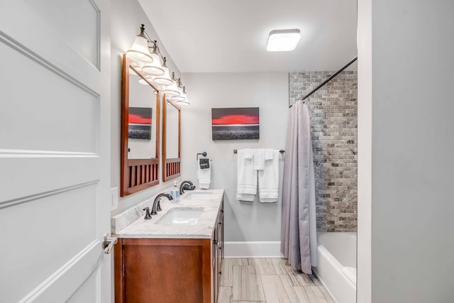 bathroom with shower / tub combo with curtain and vanity