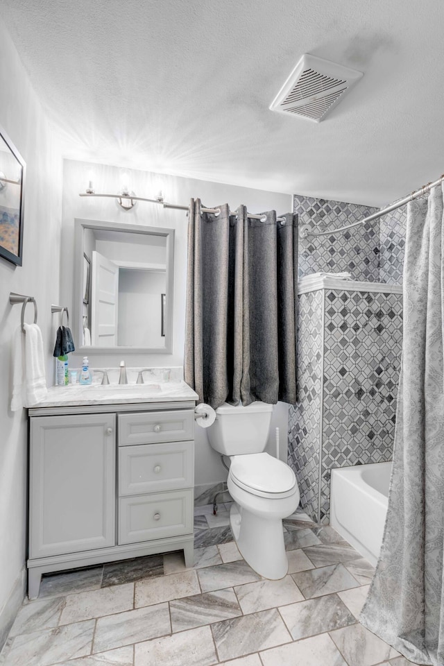 full bathroom with vanity, toilet, shower / bathtub combination with curtain, and a textured ceiling