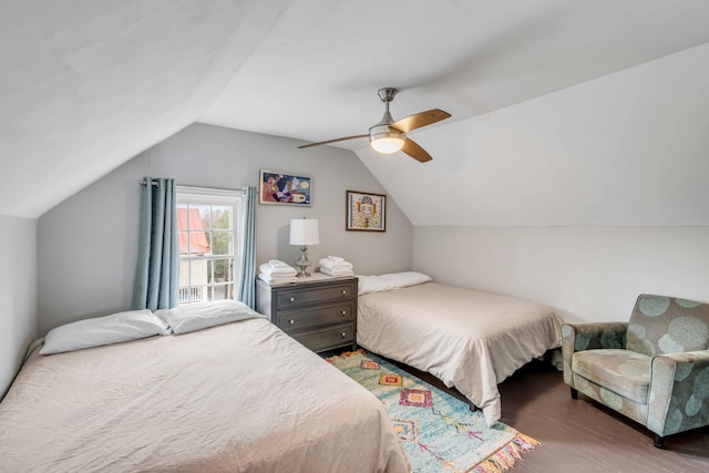 bedroom featuring vaulted ceiling, ceiling fan, and dark wood-type flooring