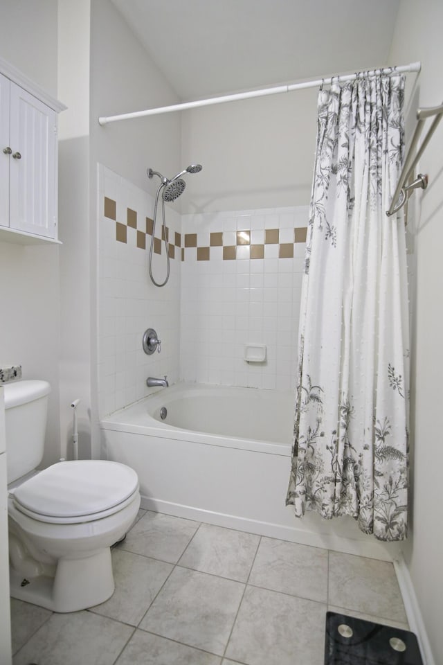 bathroom with shower / bath combo, tile patterned flooring, and toilet