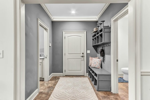 mudroom featuring baseboards and ornamental molding