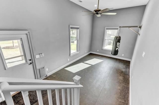 entryway featuring visible vents, a ceiling fan, baseboards, and concrete flooring