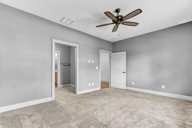 unfurnished bedroom featuring visible vents, ceiling fan, baseboards, and carpet floors