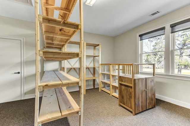 bedroom with visible vents, baseboards, and carpet flooring