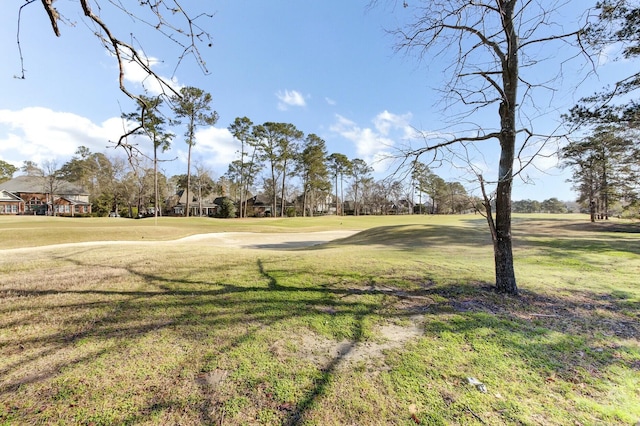 view of yard with view of golf course