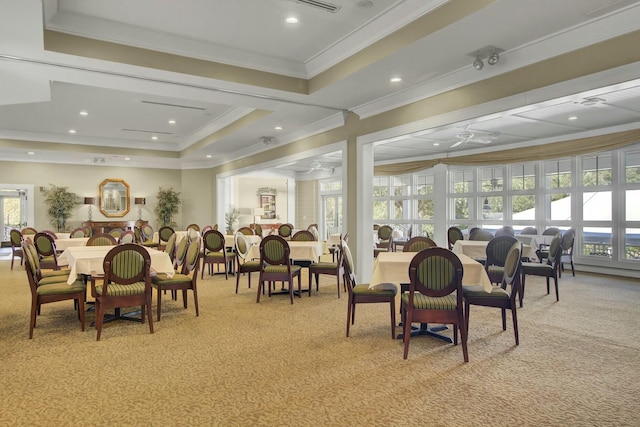 dining space with ceiling fan, a tray ceiling, ornamental molding, light carpet, and recessed lighting