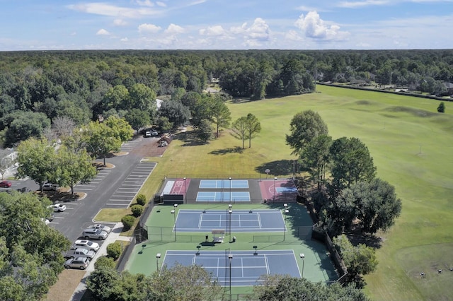 birds eye view of property with a wooded view