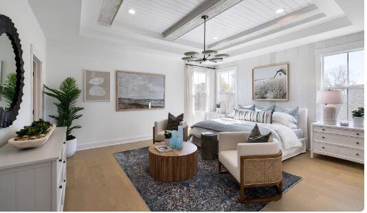 148 Falaise St, Charleston, SC 29492 - bedroom with wood finished floors, a chandelier, beamed ceiling, baseboards, and a tray ceiling