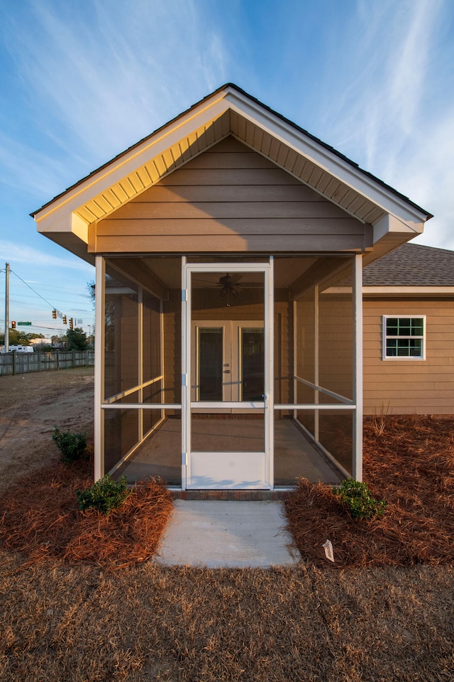 back of house with a patio and a sunroom