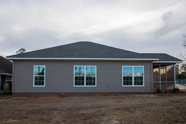 view of side of home with a sunroom