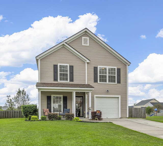 front of property with a garage, covered porch, and a front lawn