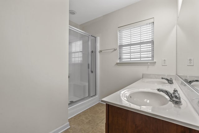 bathroom featuring vanity, an enclosed shower, and tile patterned floors