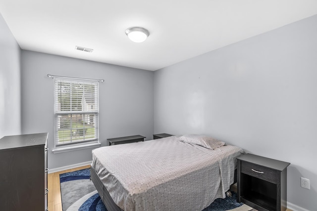 bedroom with light wood-type flooring