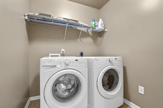 clothes washing area with independent washer and dryer