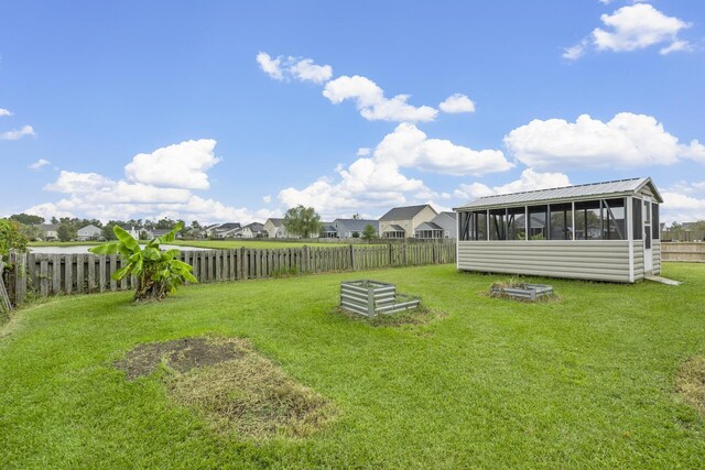 view of yard featuring a sunroom