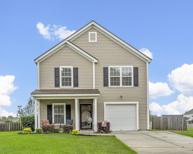 view of property featuring a garage, covered porch, and a front lawn