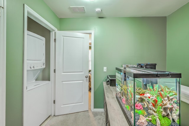 9101 Parlor Dr, Ladson, SC 29456 - laundry room with stacked washer / dryer and baseboards
