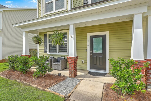 9101 Parlor Dr, Ladson, SC 29456 - doorway to property featuring a porch