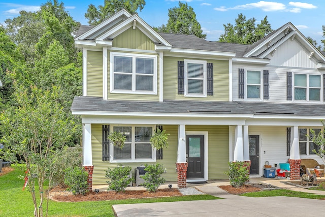 9101 Parlor Dr, Ladson, SC 29456 - view of front facade featuring a porch, board and batten siding, and a shingled roof