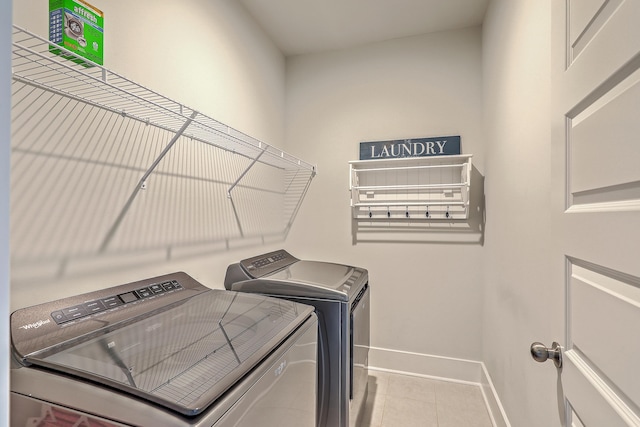 3125 Sturbridge Rd, Mount Pleasant, SC 29466 - laundry room with washing machine and clothes dryer, tile patterned flooring, and baseboards