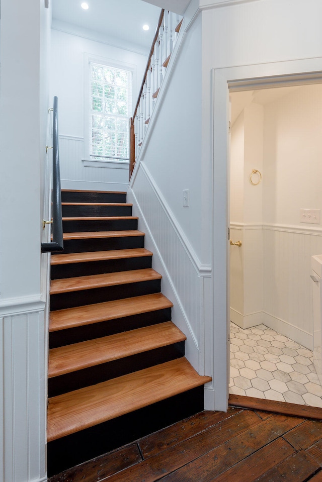 stairs with hardwood / wood-style floors