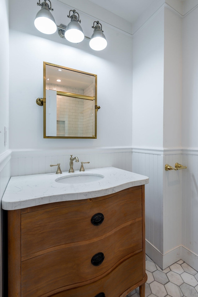 bathroom with tile patterned flooring and vanity