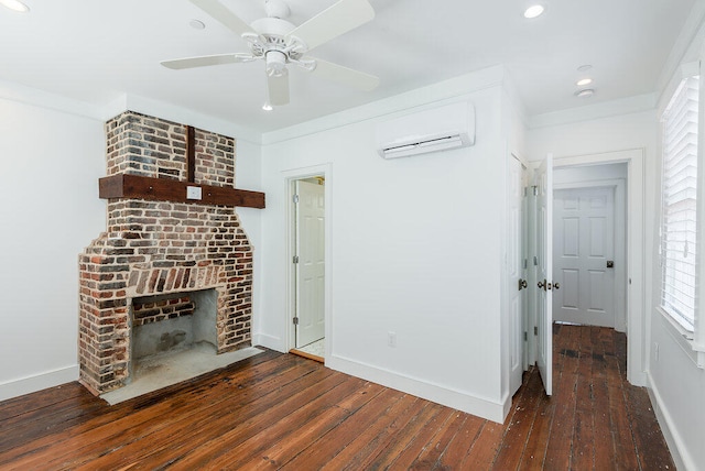 unfurnished living room featuring dark wood-type flooring, a fireplace, a wall mounted AC, crown molding, and ceiling fan