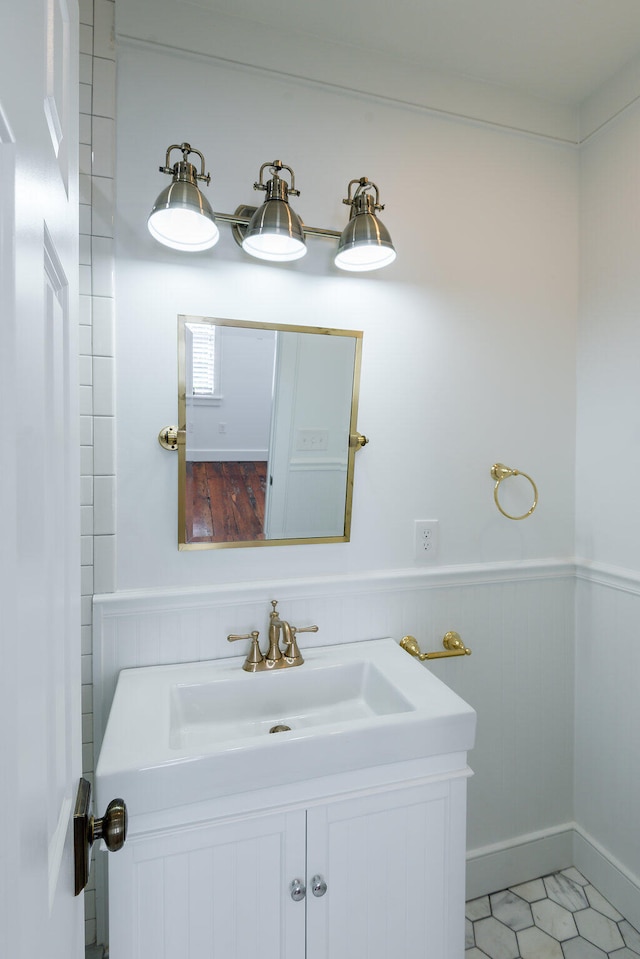 bathroom featuring tile patterned flooring and vanity