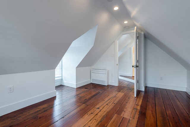 additional living space with lofted ceiling and dark hardwood / wood-style floors