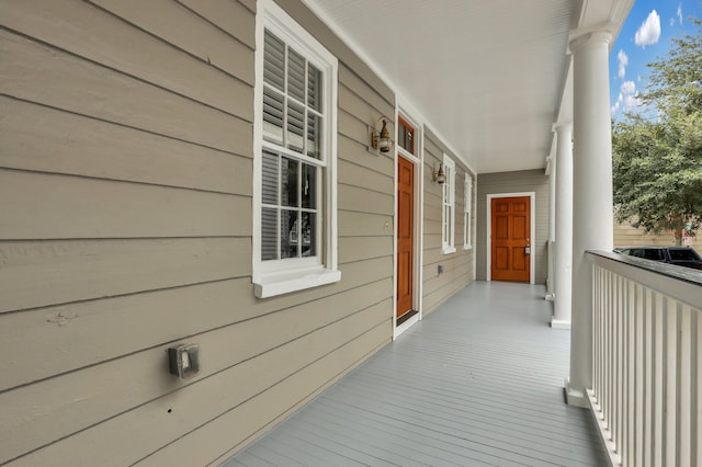 wooden terrace with a porch