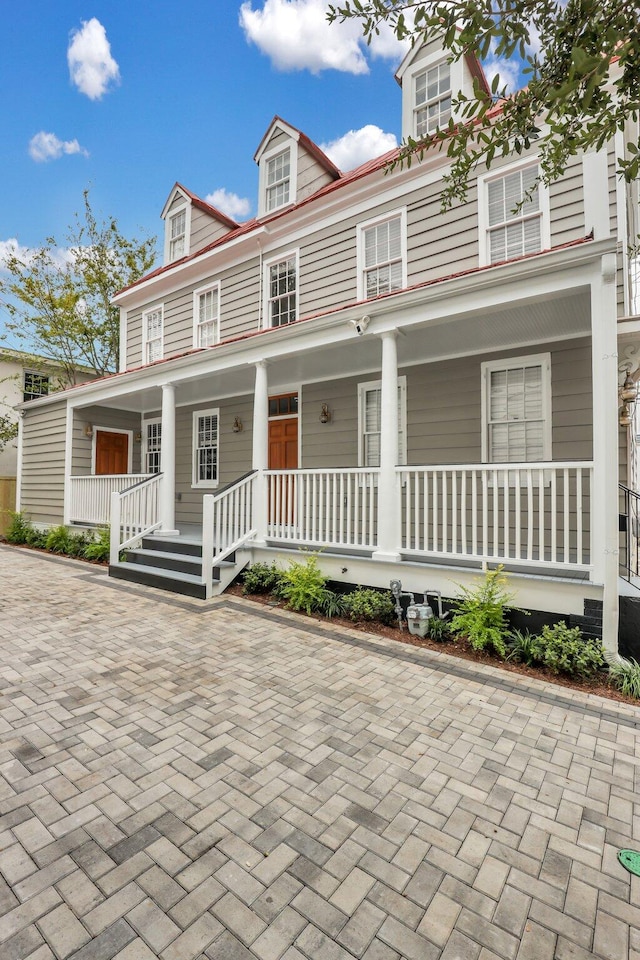 view of front of property featuring covered porch