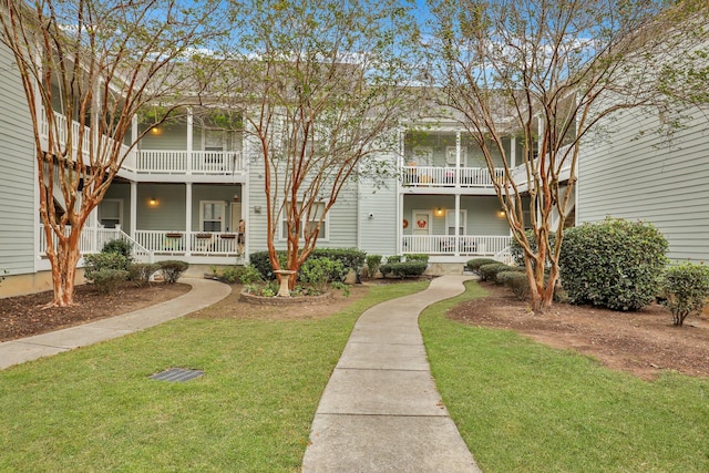 surrounding community featuring a lawn