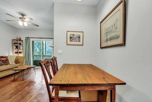 dining area with ceiling fan and wood-type flooring