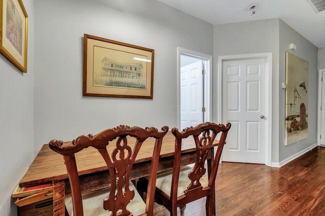 dining room featuring dark wood-type flooring