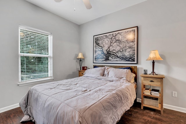 bedroom with ceiling fan and dark wood-type flooring