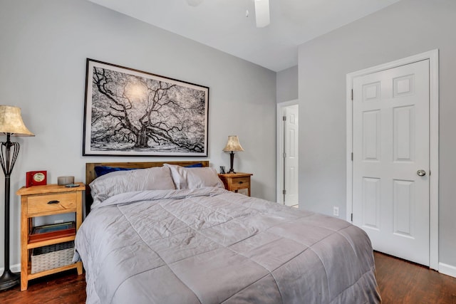 bedroom featuring ceiling fan and dark hardwood / wood-style flooring