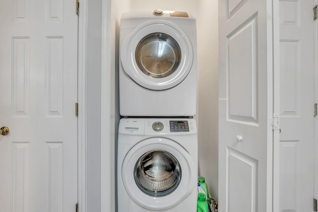 laundry area featuring stacked washer and clothes dryer