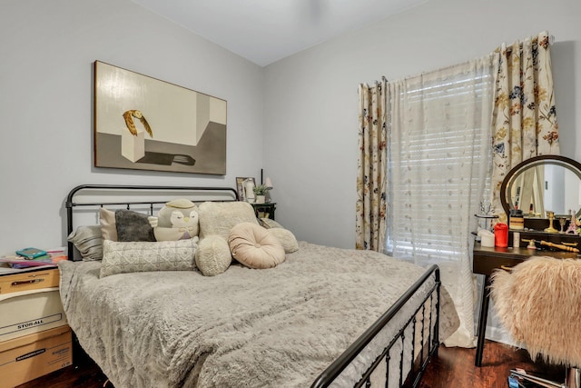 bedroom featuring dark hardwood / wood-style flooring