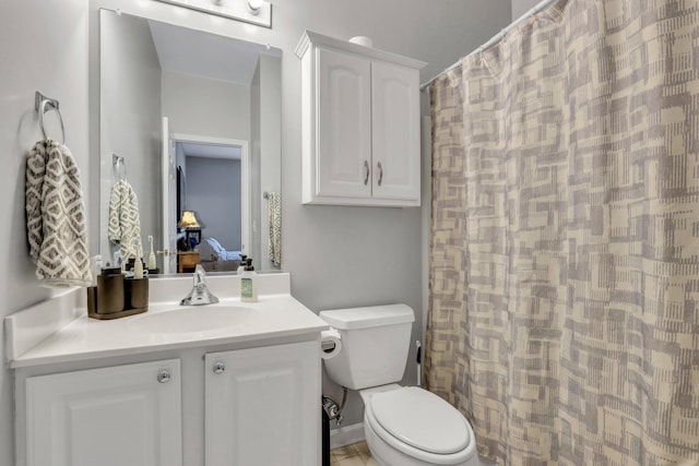 bathroom featuring a shower with curtain, vanity, and toilet