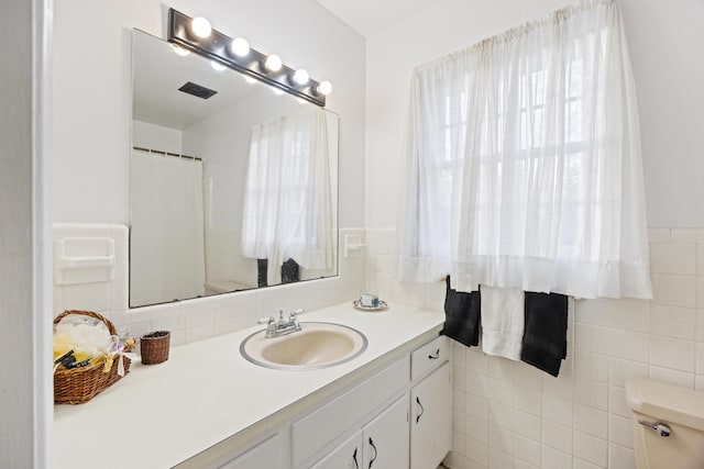 bathroom with vanity and toilet