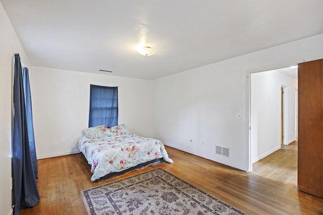 bedroom with wood-type flooring