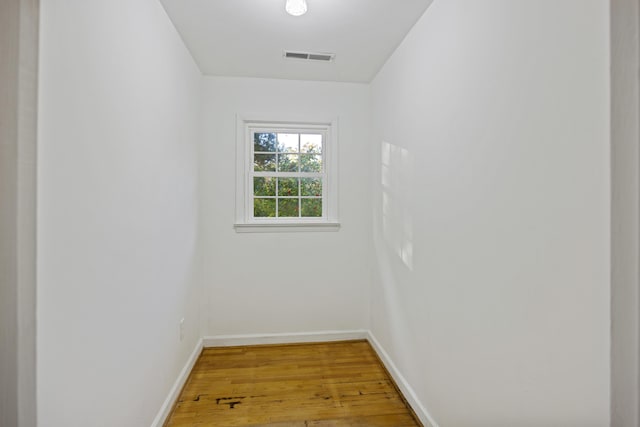 spare room with hardwood / wood-style floors